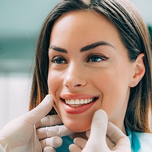 Woman's smile being examined