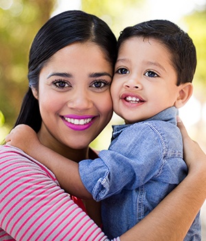Mother holding smiling child