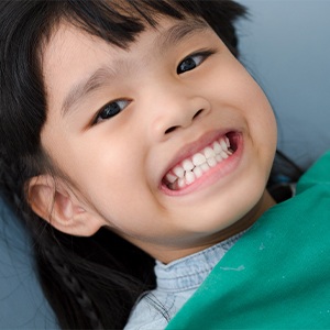 Smiling child in dental exam chair