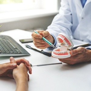 dentist discussing the health of their teeth with a patient
