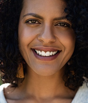 person smiling after teeth whitening in Santa Ana