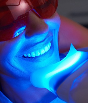 person getting teeth whitening from a cosmetic dentist in Santa Ana